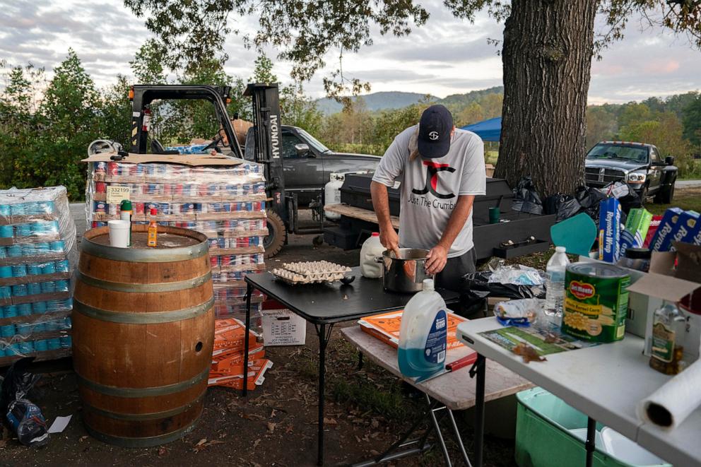 PHOTO: A volunteer makes breakfast for community members in need at Ridgeline Heating and Cooling, which has turned into a relief area and community coordination center in Bills Creek, North Carolina, Oct. 3, 2024, after the passage of Hurricane Helene. 