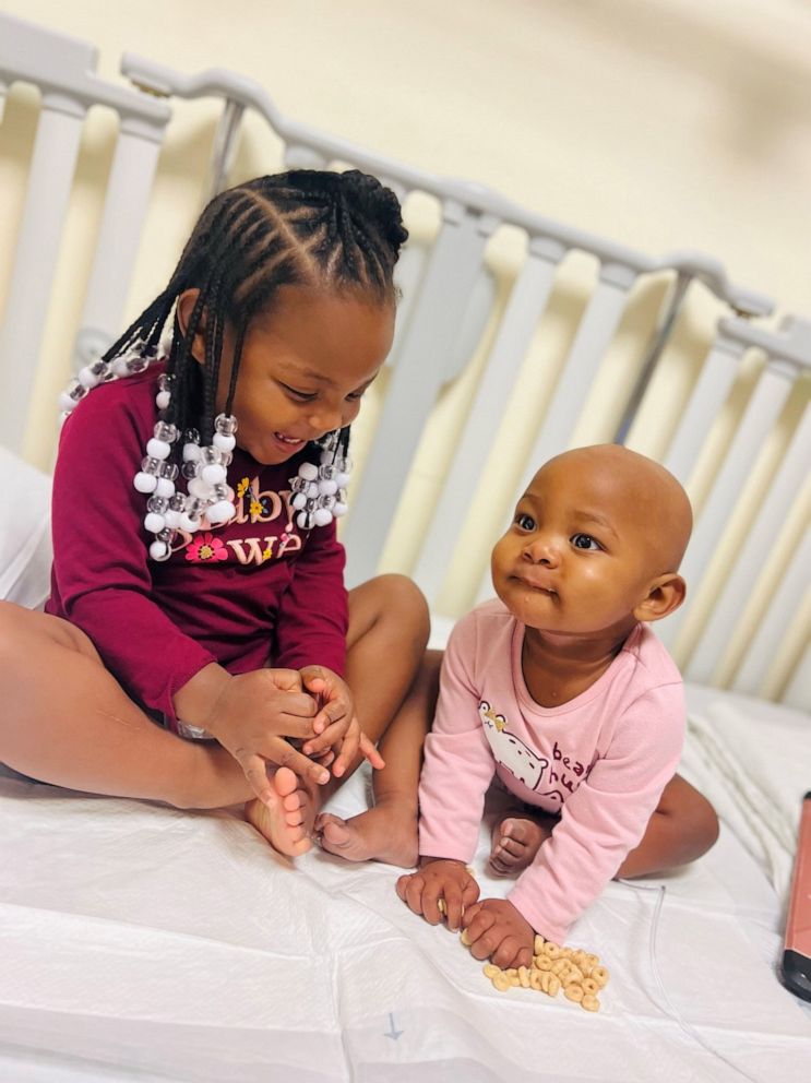 PHOTO: Nova, 1, is receiving treatment for neuroblastoma tumors, a type of cancer that affects the adrenal glands. Her parents say her older sister, Nyla, has been a huge support for her and the two siblings have a close relationship.