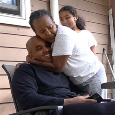 PHOTO: Asmeret Mengistu gives her son Abel Mezemer a hug after they both learn Mezemer passed his nursing licensure exam.