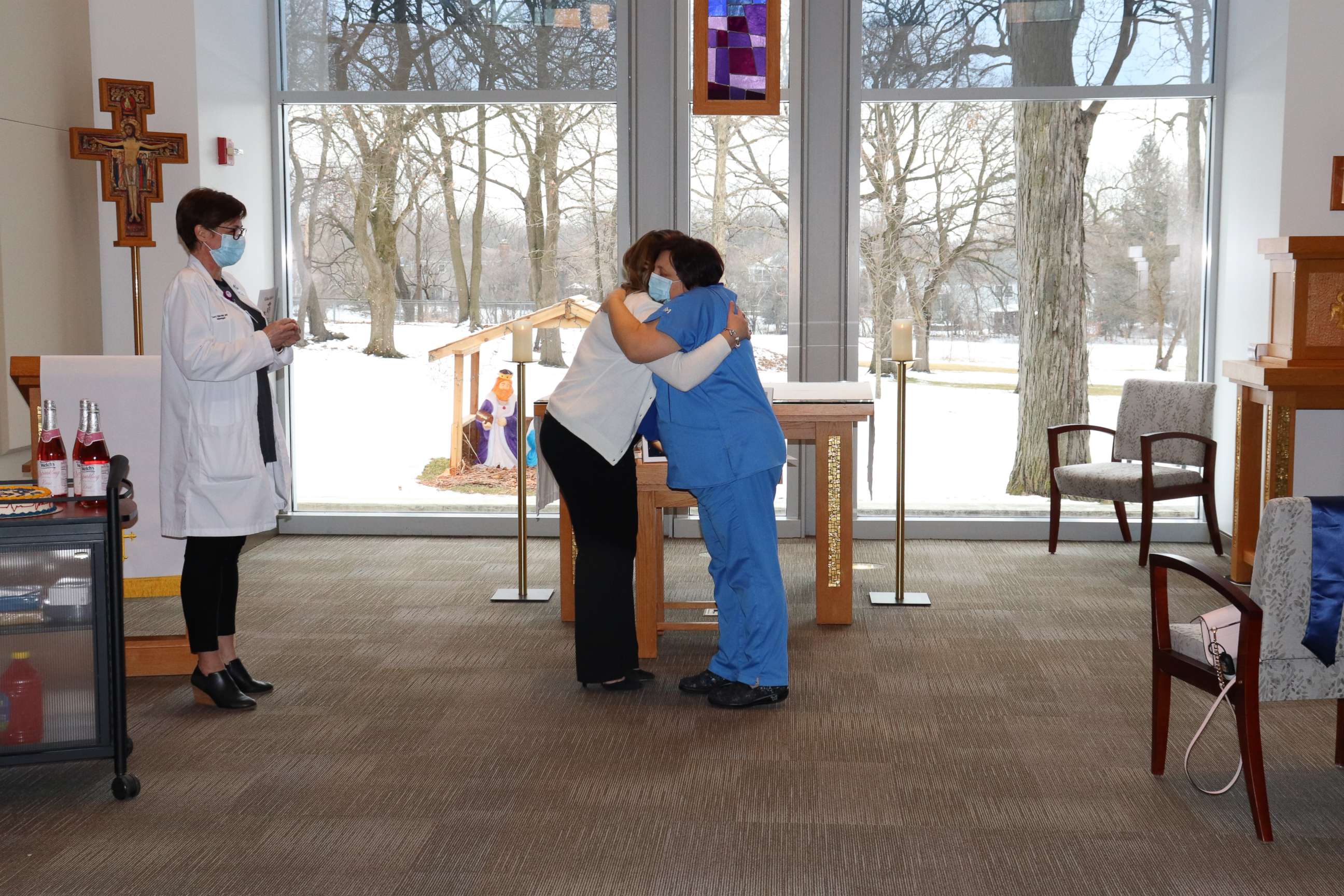 PHOTO: Edina Habibovic, 22, hugs Sanja Josipovic at her own pinning ceremony at Marianjoy Rehabilitation Hospital in DuPage County, Illinois, after graduating from nursing school.