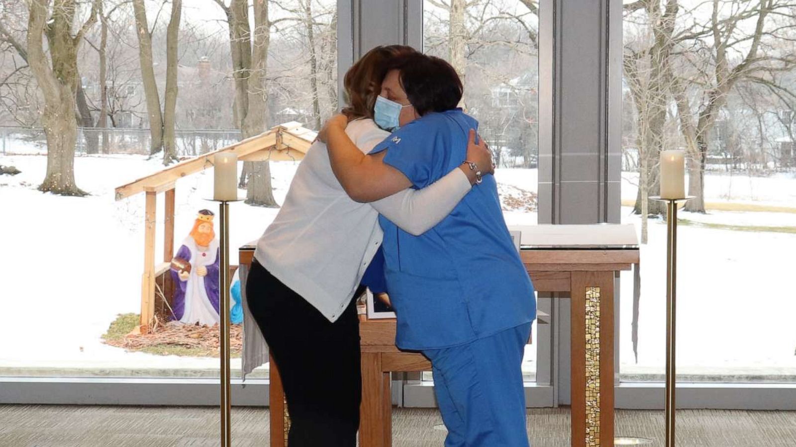 PHOTO: Edina Habibovic, 22, hugs Sanja Josipovic at her own pinning ceremony at Marianjoy Rehabilitation Hospital in DuPage County, Illinois, after graduating from nursing school.