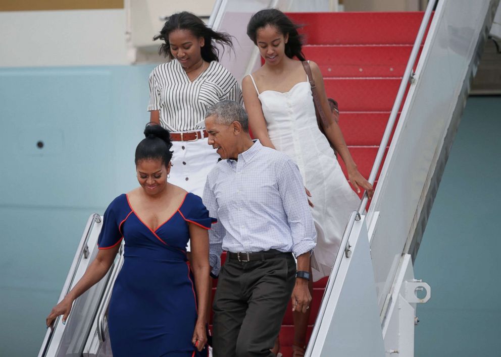 PHOTO: President Barack Obama, first lady Michelle Obama, and their daughters, Sasha, top left, and Malia, step off Air Force One at Joint Base Cape Cod for a vacation, Aug. 6, 2016.