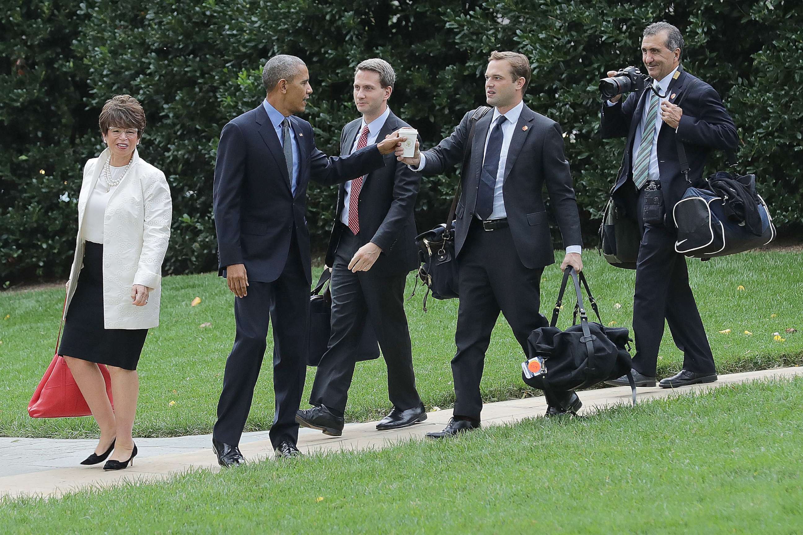 PHOTO: In this file photo, President Barack Obama is joined by advisor Valerie Jarrett, Principal Deputy Press Secretary Eric Schultz, personal aide Joe Paulsen and photographer Pete Souza as they depart the White House, Oct. 7, 2016, in Washington, DC.