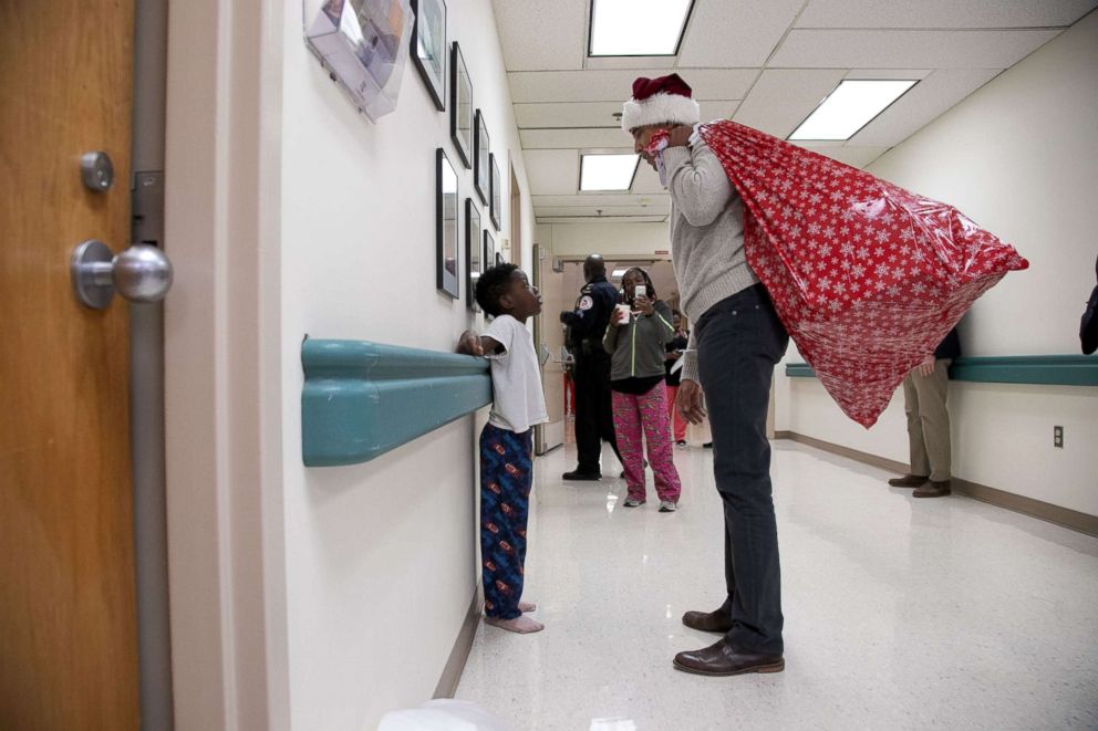 PHOTO: Former President Barack Obama visited children and families at the Children's National hospital in Washington, D.C., Dec. 19, 2018, to drop off some Christmas gifts.