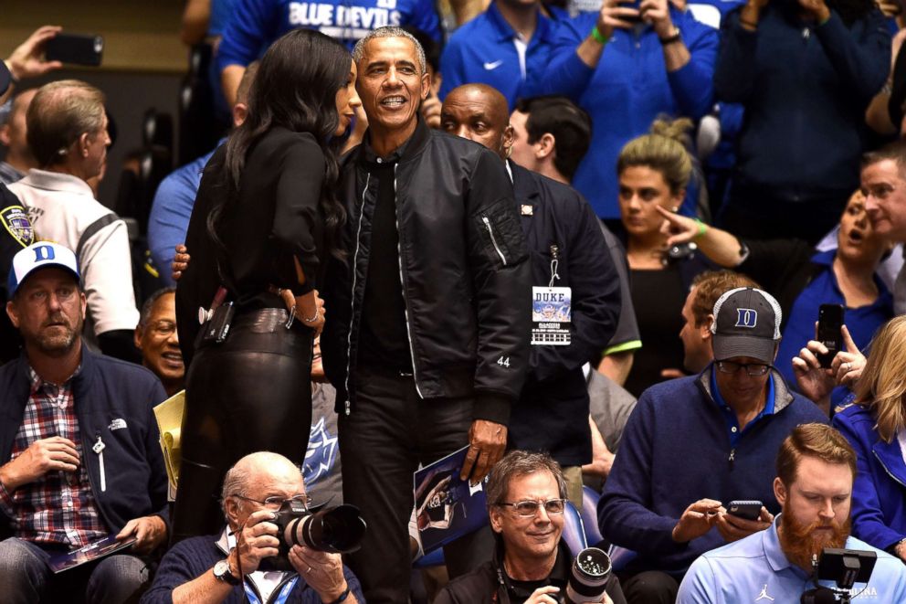 PHOTO: Former President Barack Obama talks with ESPN analyst Maria Taylor while attending the game between the North Carolina Tar Heels and the Duke Blue Devils at Cameron Indoor Stadium, Feb. 20, 2019, in Durham, N.C.