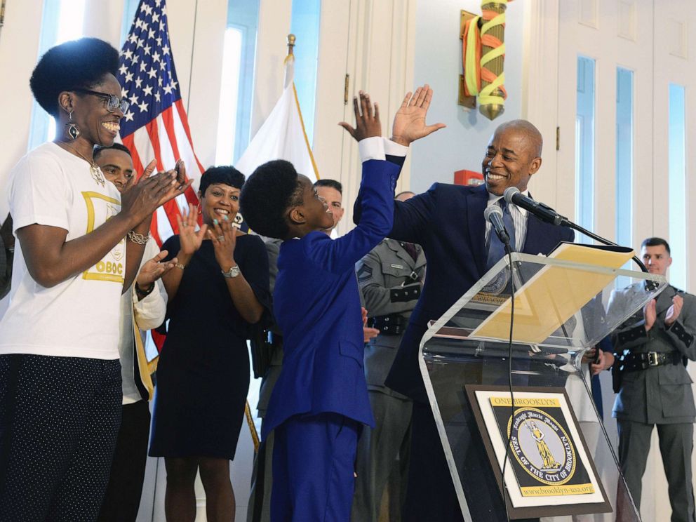 PHOTO: Brooklyn Borough President Eric Adams honors young CEO Obocho Peters as Hero of the Month at a ceremony in June of 2019.