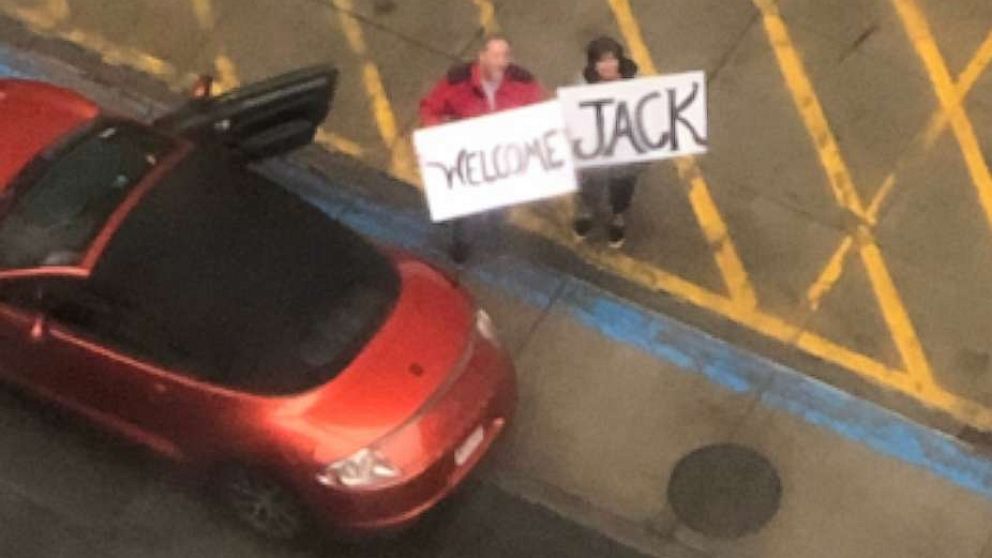 PHOTO: Grandparents, Tod and Judy O’Donnell, hold signs outside of the hospital to welcome new baby, Jack O’Donnell, in Boston, Mass.