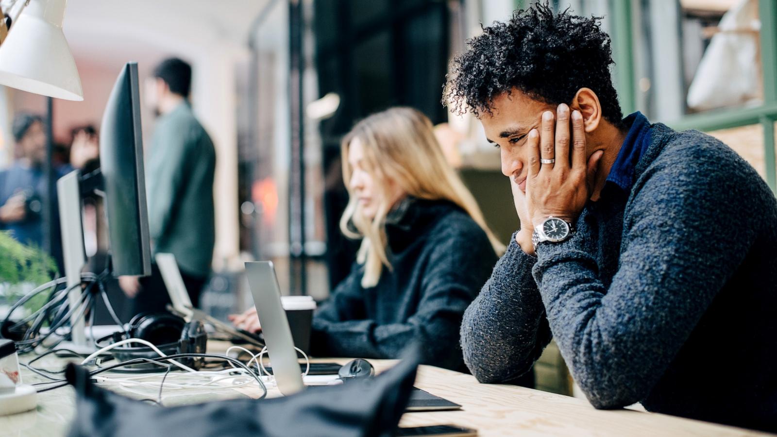 PHOTO: Stock photo of people working in an office setting.