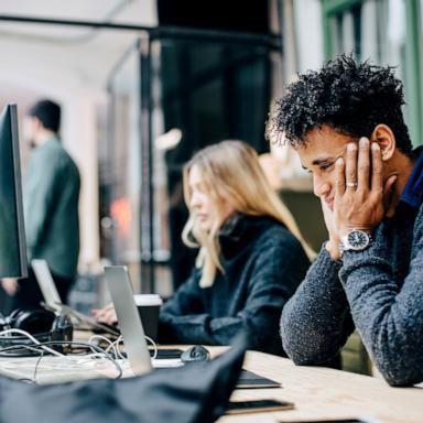 PHOTO: Stock photo of people working in an office setting.