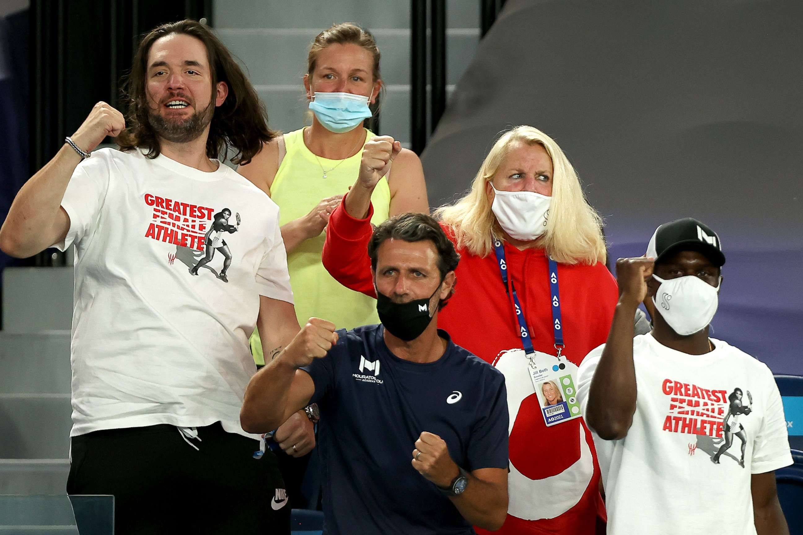 PHOTO: People sitting in the box for Serena Williams, including her husband Alexis Ohanian, left, and coach Patrick Mouratoglou, center, cheer her on during her women's singles match at the Australian Open in Melbourne on Feb. 16, 2021.