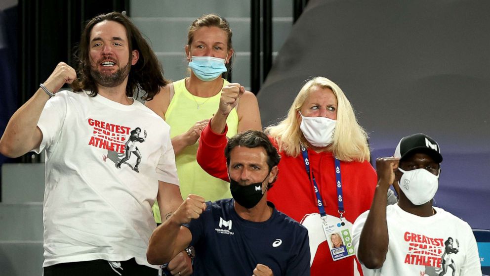 PHOTO: People sitting in the box for Serena Williams, including her husband Alexis Ohanian, left, and coach Patrick Mouratoglou, center, cheer her on during her women's singles match at the Australian Open in Melbourne on Feb. 16, 2021.