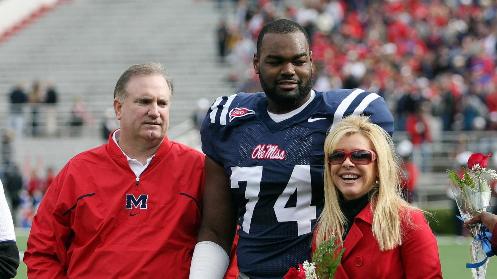 PHOTO: Michael Oher #74 of the Ole Miss Rebels stands with his family during senior ceremonies prior to a game against the Mississippi State Bulldogs at Vaught-Hemingway Stadium on Nov. 28, 2008 in Oxford, Miss.