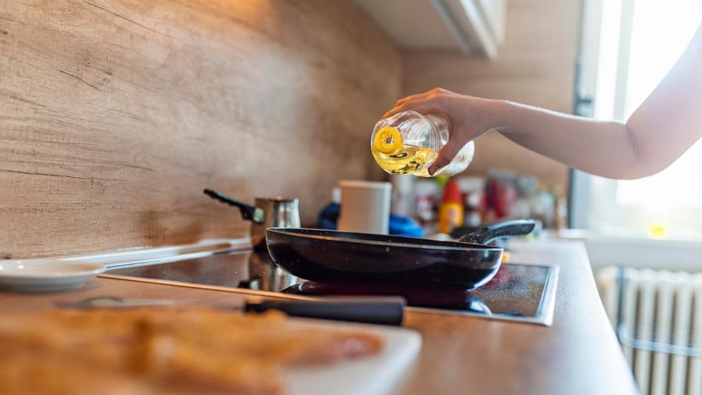 PHOTO: Stock photo of a person cooking in the kitchen.