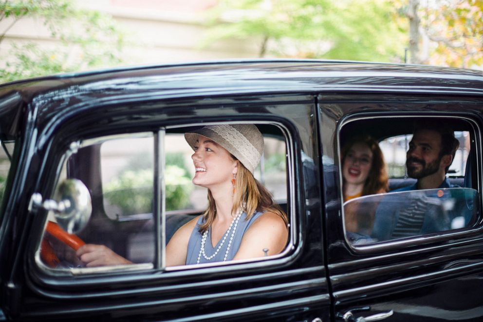 PHOTO: People inside black Nowaday car.