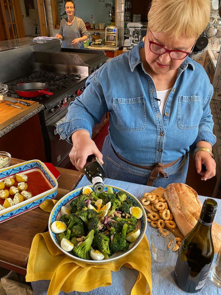 PHOTO: Lidia Bastianich drizzles olive oil over a broccoli and bean salad.