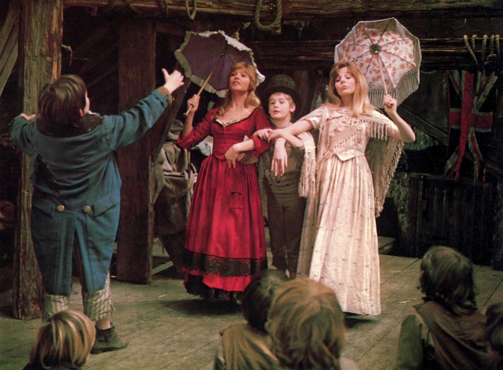 PHOTO: Jack Wild, Shani Wallis, Mark Lester, and Sheila White, appear in the 1968 British musical film, "Oliver!"
