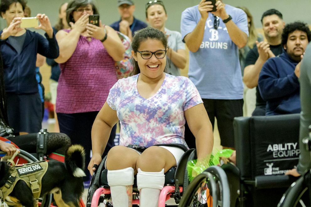 PHOTO: Olivia Curcuru presented with custom wheelchair at Angel City Games, 2019.