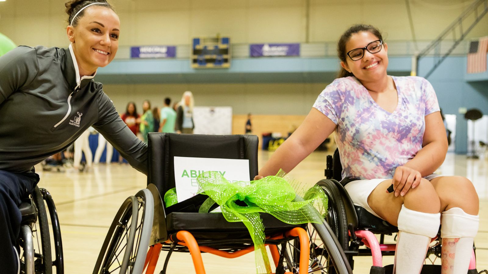 PHOTO: Megan Blunk, a 2016 USA Paralympian, presents a custom wheelchair to 13-year-old Olivia Cucuru at the Angel City Games in Los Angeles in June 2019.