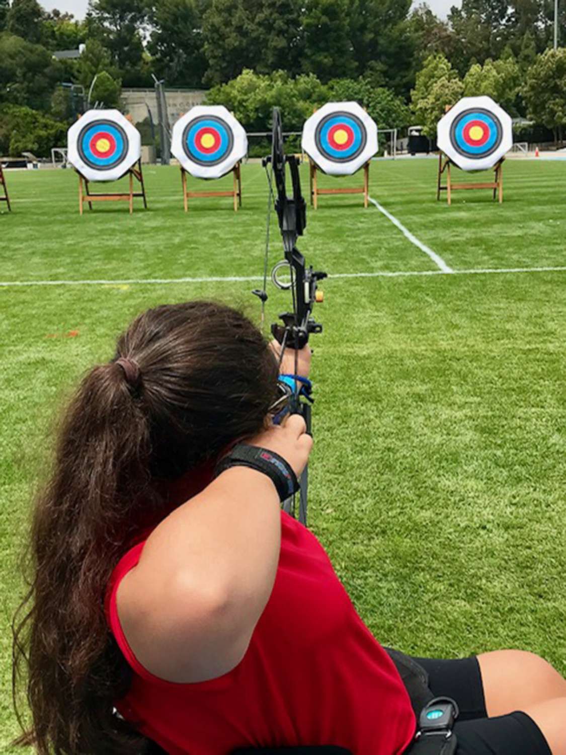 PHOTO: Olivia Curcuru competes at archery during the Angel City Games in Arizona, in June 2019.