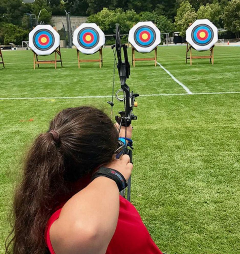 PHOTO: Olivia Curcuru competes at archery during the Angel City Games in Arizona, in June 2019.