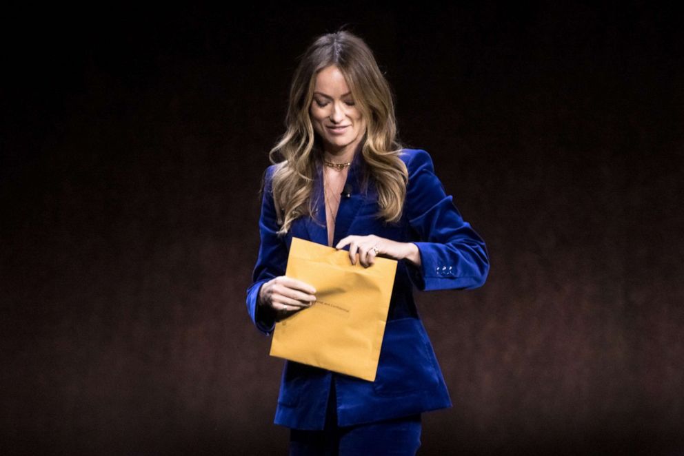PHOTO: Olivia Wilde holds an envelope reading "personal and confidential" as she speaks onstage during the Warner Bros. Pictures "The Big Picture" presentation during CinemaCon 2022 at Caesars Palace in Las Vegas, April 26, 2022.