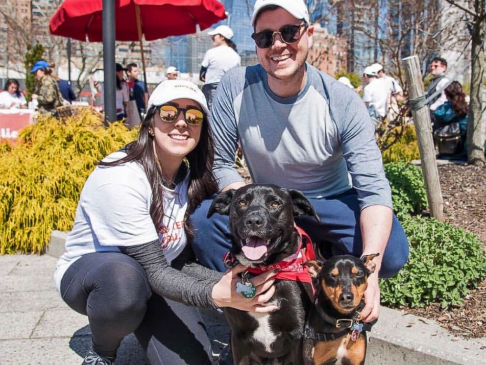 PHOTO: Mollie McGill and Patrick Sullivan are pictured with their dog Cooper and a foster dog in an undated handout photo.