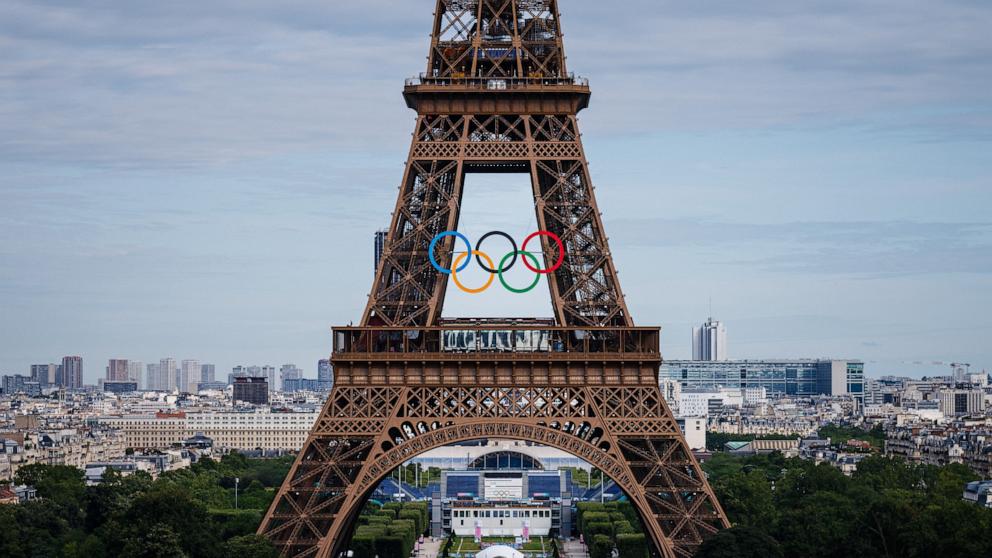 PHOTO: This photograph shows the Olympic Rings on the Eiffel Tower ahead of the traditional fireworks marking the annual Bastille Day in Paris, on July 14, 2024. 