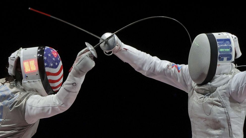 PHOTO: Lee Kiefer, right, competes against Inna Deriglazova of the Russian Olympic Committee in their gold medal match in individual foil or fencing in Chiba, Japan on July 25, 2021.