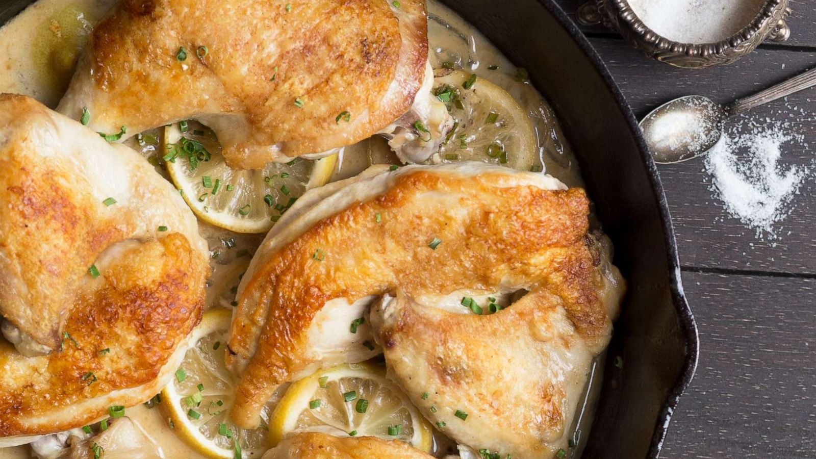 PHOTO: A cast-iron skillet of roasted chicken.