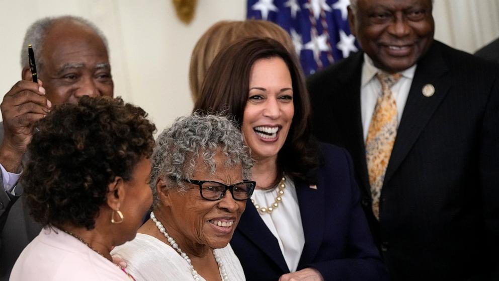 PHOTO: In this June 17, 2021, file photo, 94-year-old Opal Lee holds hands with Vice President Kamala Harris as President Joe Biden signs the Juneteenth National Independence Day Act into law in the East Room of the White House in Washington, D.C.