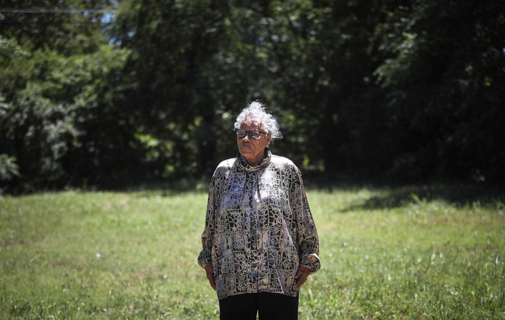 PHOTO: Opal Lee, 93, stands in front of the East Annie Street lot on June 2, 2021, where white rioters attacked, invaded and burned her family's home in 1939.