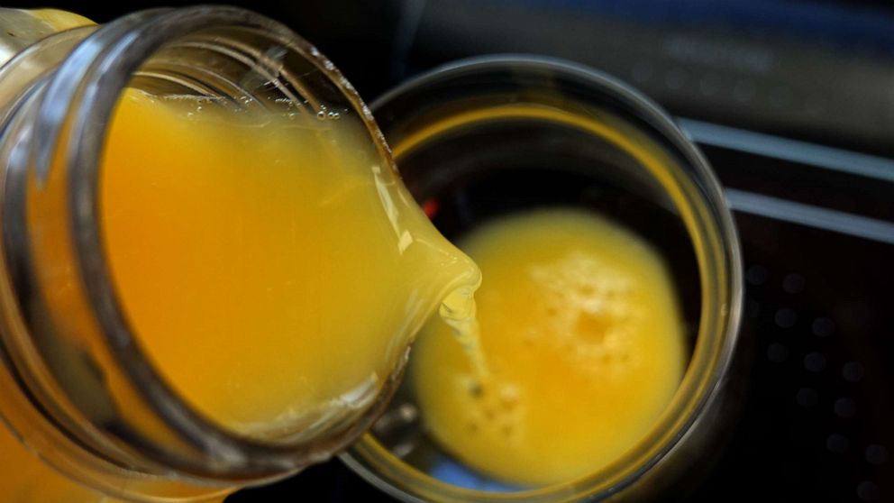 PHOTO: In this photo illustration, orange juice is poured into a glass.