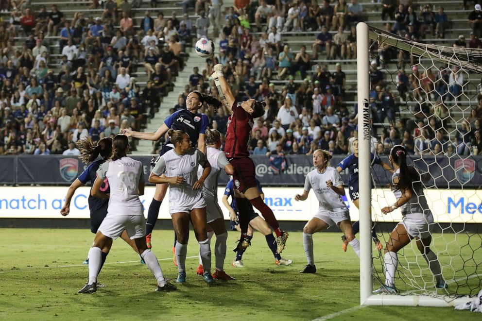 PHOTO: Kaylie Collins #18 of Orlando Pride jumps to defend the goal in the first half against San Diego Wave FC at Torero Stadium, Aug. 13, 2022, in San Diego.