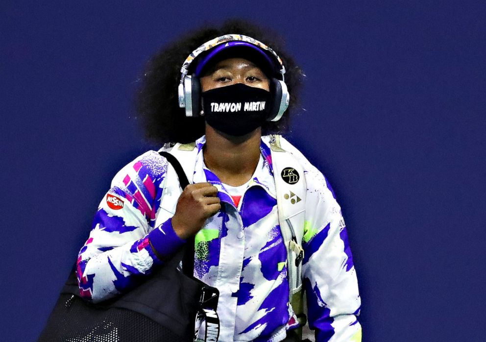 PHOTO: Naomi Osaka of Japan walks out wearing a mask with the name of Trayvon Martin printed on it before her Women's Singles fourth round match against Anett Kontaveit of Estonia on Day Seven of the US Open, Sept. 6, 2020, in Queens, New York.