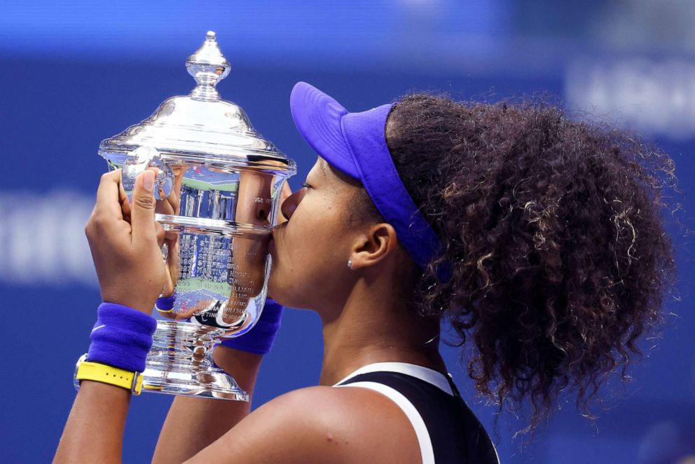 PHOTO: Naomi Osaka of Japan kisses the trophy in celebration after winning her Women's Singles final match against Victoria Azarenka of Belarus at the U.S. Open, Sept. 12, 2020, in New York City.