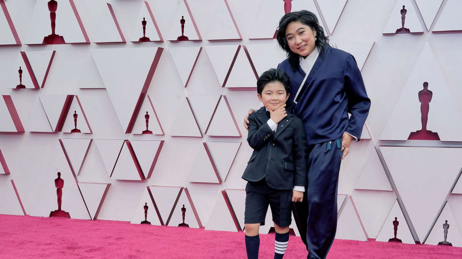 PHOTO: Alan S. Kim and Christina Oh arrive to the 93rd Academy Awards in Los Angeles, April 25, 2021.