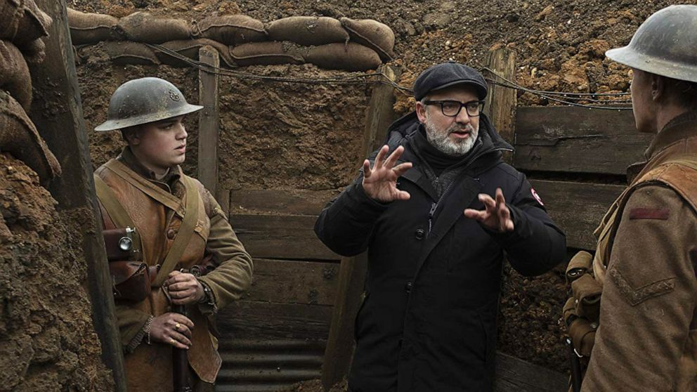 PHOTO: Director Sam Mendes speaks with actors George McKay and Dean-Charles Chapman on the set of the 2019 film, "1917."
