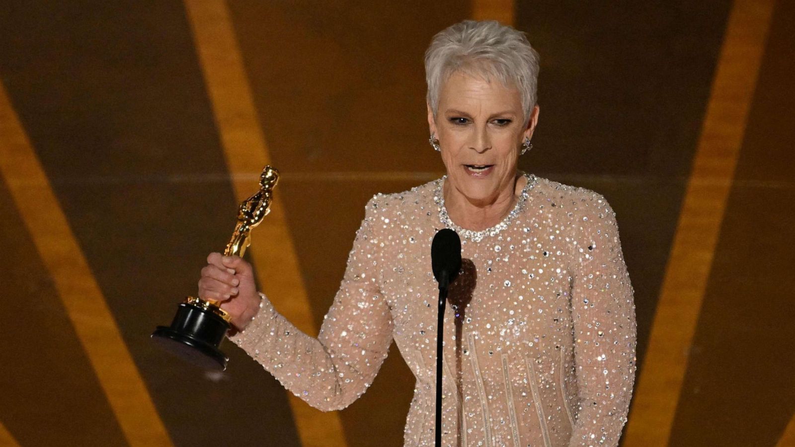 PHOTO: Jamie Lee Curtis accepts the Oscar for Best Actress in a Supporting Role for "Everything Everywhere All at Once" onstage during the 95th Annual Academy Awards at the Dolby Theatre in Hollywood, California on March 12, 2023.