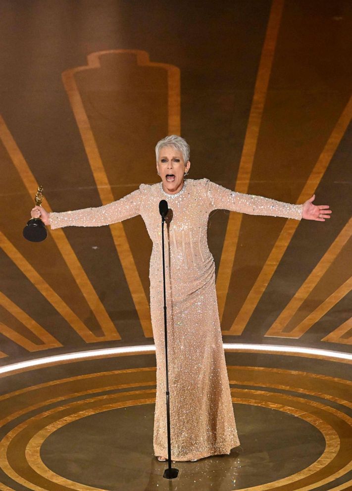 PHOTO: Jamie Lee Curtis accepts the Oscar for Best Actress in a Supporting Role for "Everything Everywhere All at Once" onstage during the 95th Annual Academy Awards at the Dolby Theatre in Hollywood, California on March 12, 2023.