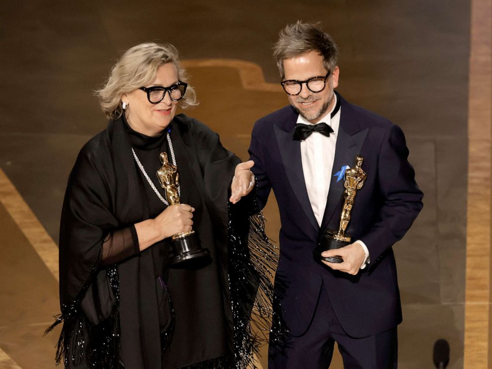 PHOTO: Ernestine Hipper and Christian M. Goldbeck accept the Best Production Design award for "All Quiet on the Western Front" onstage during the 95th Annual Academy Awards at Dolby Theatre on March 12, 2023 in Hollywood, California.