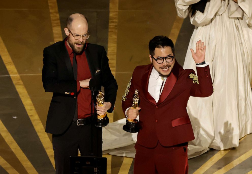 PHOTO: Daniel Scheinert and Dan Kwan accept the Best Original Screenplay award for "Everything Everywhere All at Once" onstage during the 95th Annual Academy Awards at Dolby Theatre on March 12, 2023 in Hollywood, California.