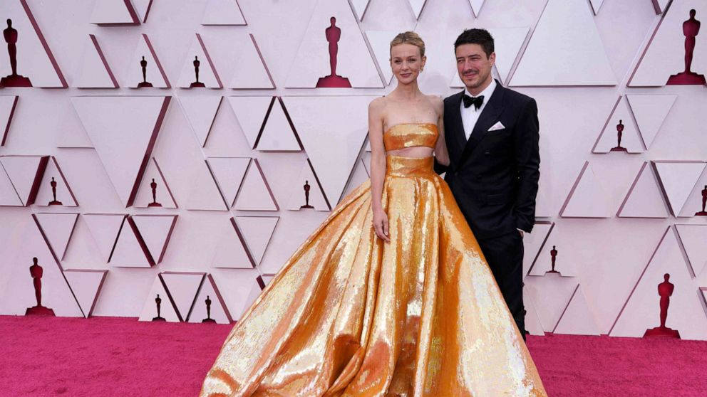 PHOTO: British actress Carey Mulligan and husband US-British musician Marcus Mumford  arrive to the 93rd Academy Awards, at Union Station, in Los Angeles, April 25, 2021.