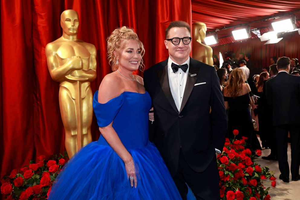 PHOTO: Jeanne Moore and Brendan Fraser attend the 95th Annual Academy Awards, Mar. 12, 2023, in Hollywood.