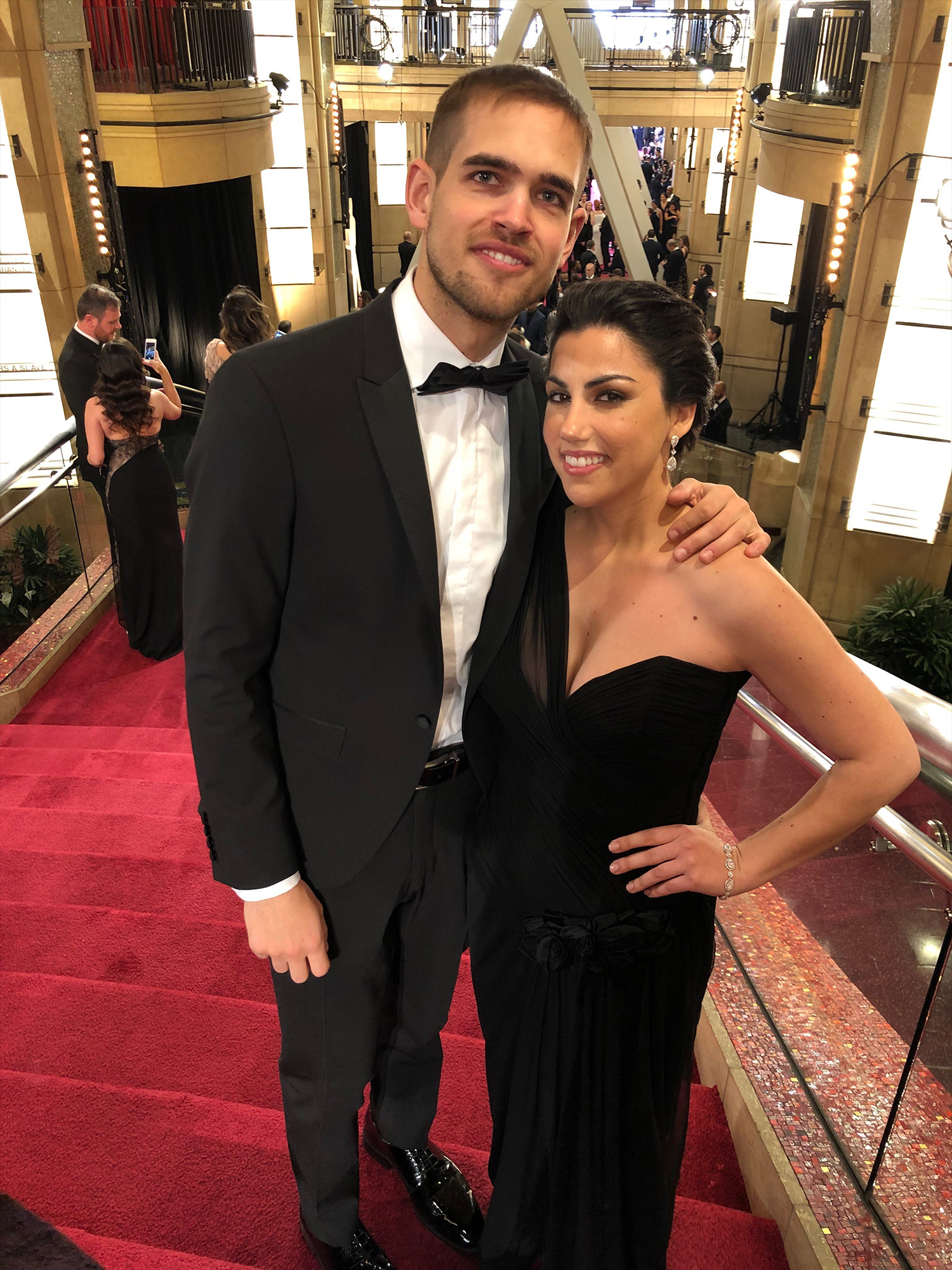 PHOTO: Rayka Zehtabchi and Sam Davis pose on the steps on the Dolby Theatre before entering the Oscars ceremony.