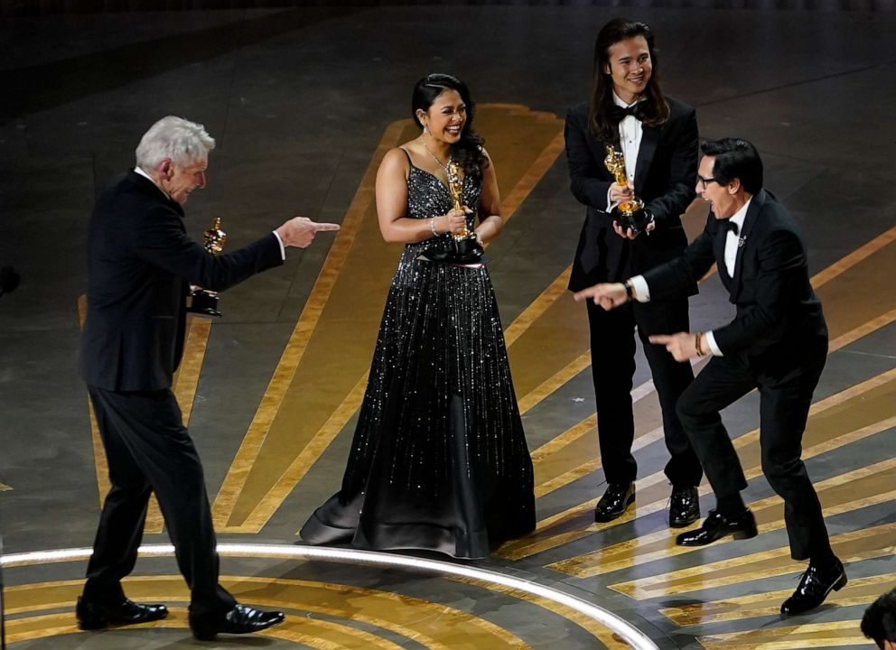 PHOTO: Presenter Harrison Ford celebrates with Ke Huy Quan as "Everything Everywhere All at Once" wins the award for Best Picture during the 95th Academy Awards in Hollywood, Mar. 12, 2023.