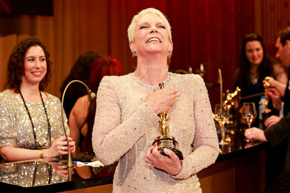 PHOTO: Jamie Lee Curtis, winner of the Best Supporting Actress award for "Everything Everywhere All at Once" holds her Oscars statue after having it engraved with her name at the Governors Ball, Mar. 12, 2023, in Hollywood.