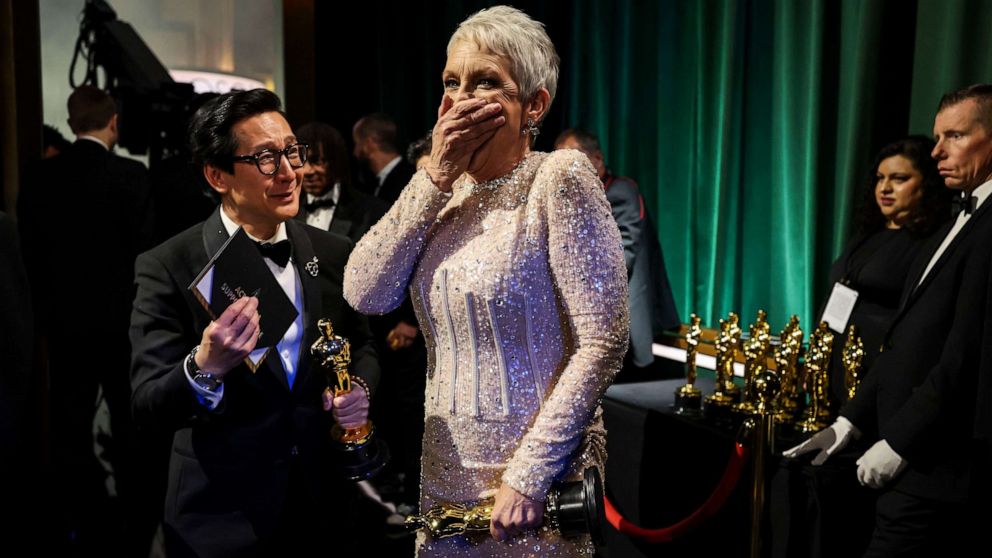 PHOTO: Jamie Lee Curtis, winner of Best Supporting Actress and Ke Huy Quan, winner of Best Actor In A Supporting Role award both for their roles in "Everything Everywhere All At Once, backstage at the 95th Academy Awards, Mar. 12, 2023, in Hollywood.