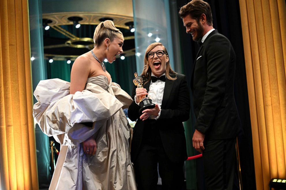 PHOTO: Best Adapted Screenplay winner for "Women Talking," Sarah Polley stands with presenters Florence Pugh, and Andrew Garfield backstage during the 95th Annual Academy Awards, Mar. 12, 2023, in Hollywood.