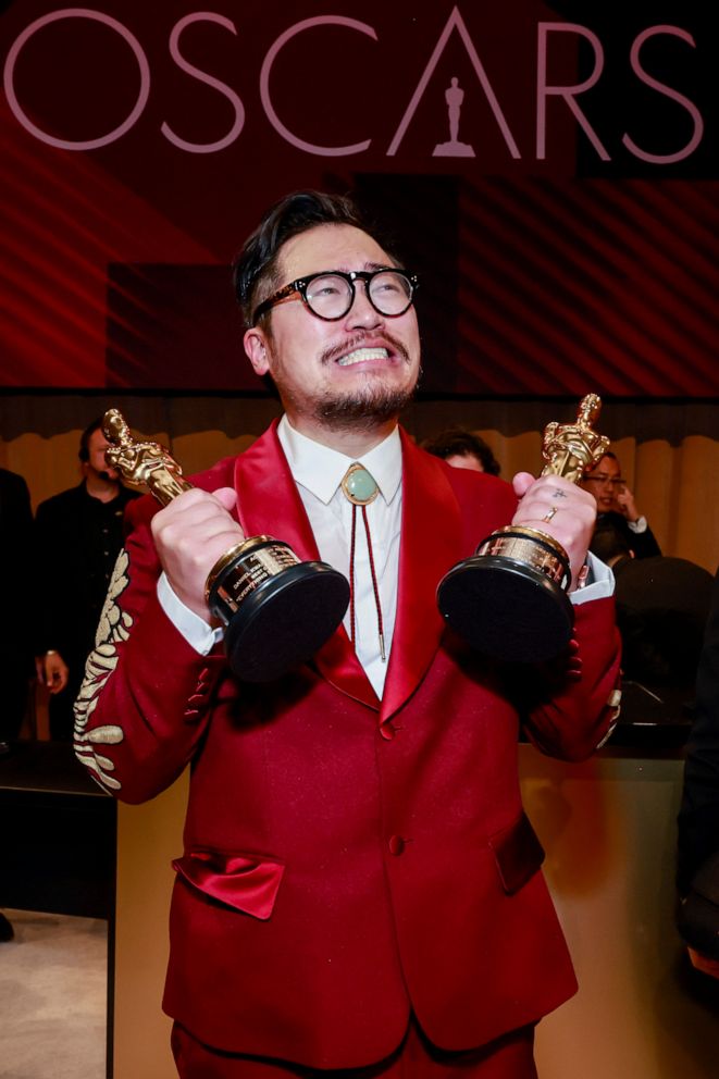 PHOTO: Dan Kwan, winner of the Best Director and Best Picture award for "Everything Everywhere All at Once," holds his two Oscars at the Governors Ball following the 95th Annual Academy Awards, Mar. 12, 2023, in Hollywood.