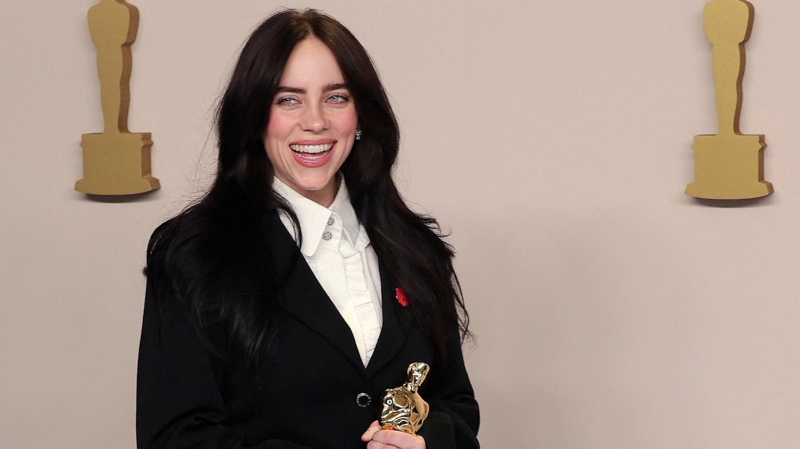 PHOTO: Billie Eilish poses with the Oscar for Best Original Song for "What Was I Made For?" from "Barbie" in the Oscars photo room at the 96th Academy Awards in Hollywood, Los Angeles, March 10, 2024.